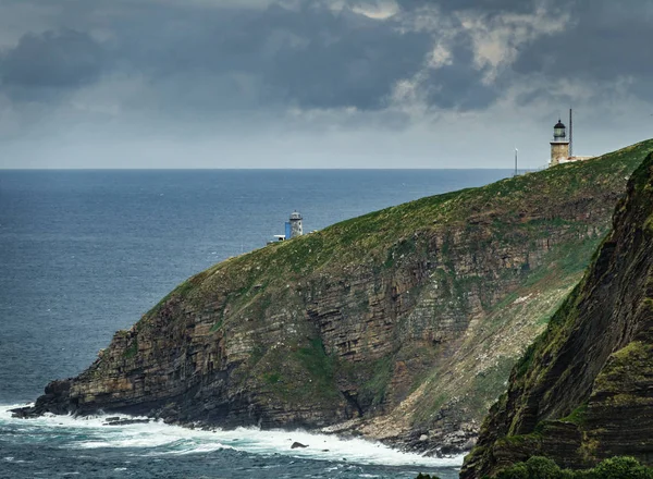 Machichaco cape régi és új világítótornyok ellen az óceán — Stock Fotó