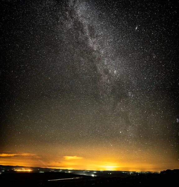 Milky way over country area with small villages — Stock Photo, Image