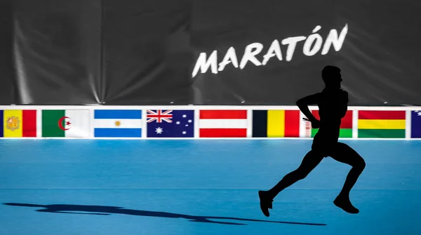 Fast marathon runner silhouette with blurred background