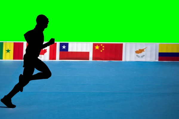Fast marathon runner silhouette with green background and flags