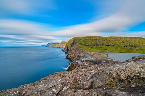 Bosdalafossur waterfall on Vagar island coastline long exposure, Faroe Islands — Stock Photo, Image