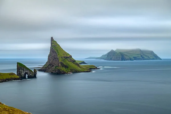 Amazing top view long exposure of Drangarnir gate, Tindholmur and Mykines, Faroe Islands — Stock Photo, Image