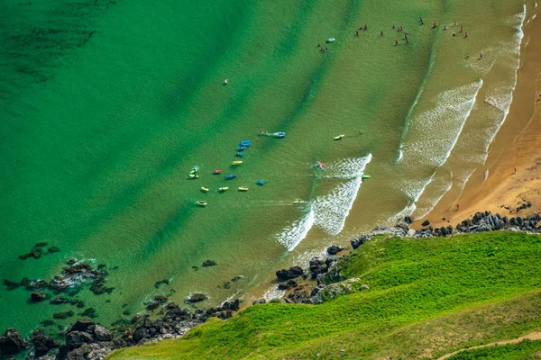 Top view of beach with kayaks and bright colors