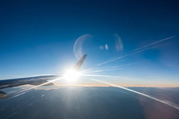 Light beams in jet airplane wing flying — Stock Photo, Image