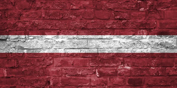 Σημαία Της Λεττονίας Πάνω Από Ένα Παλιό Τούβλο Τοίχο Υπόβαθρο — Φωτογραφία Αρχείου