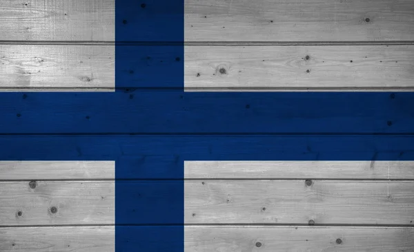 Finlandiya bayrağı ahşap arka plan, yüzey üzerinde. Ahşap duvar, plakalar. Ulusal bayrak.
