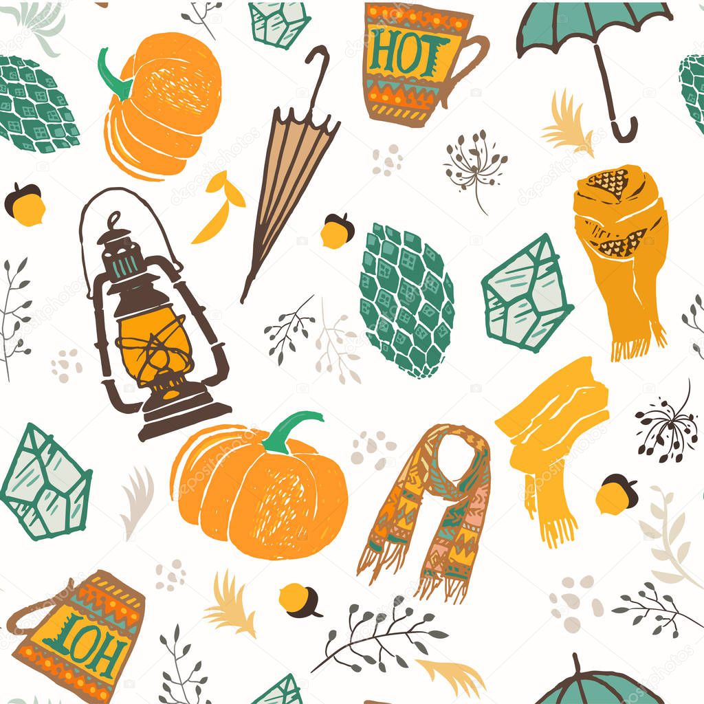 Autumn seamless pattern. Vector illustration with handdrawn doodles, orange pumpkin, umbrella, lantern, cone, cup of hot tea or coffee, scarf, branches,flowers, acorns and dots, isolated on white