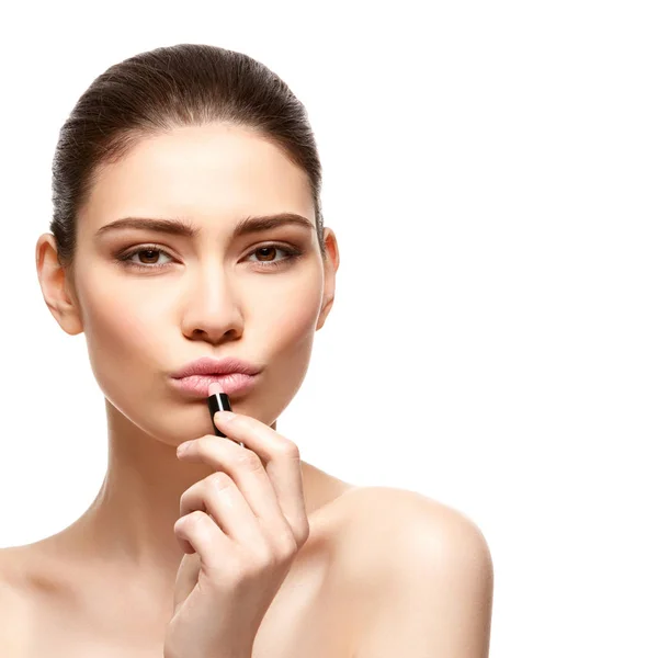 Girl applying pink lipstick isolated on white — Stock Photo, Image