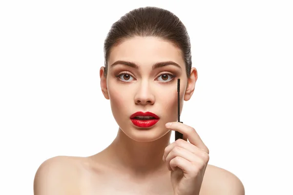 Girl applying eyelash mascara isolated on white — Stock Photo, Image