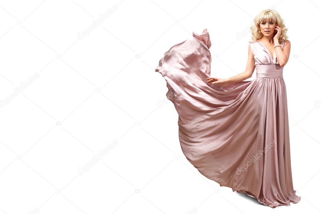 girl in flying pink dress isolated on white