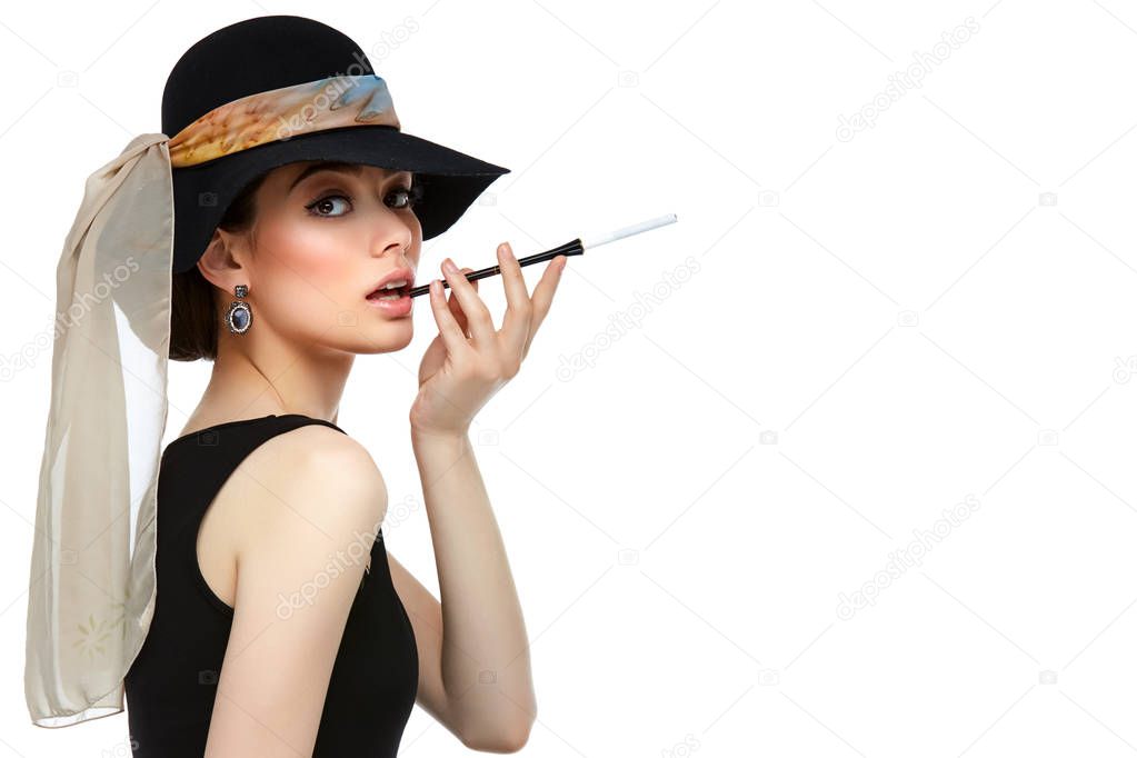 beautiful young woman in retro style with cigarette