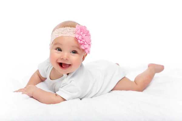 Happy beautiful baby girl in white body suit — Stock Photo, Image