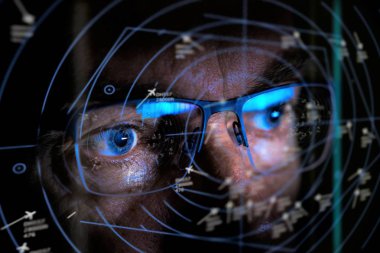 close up of air traffic controller looking at screen selective focus clipart