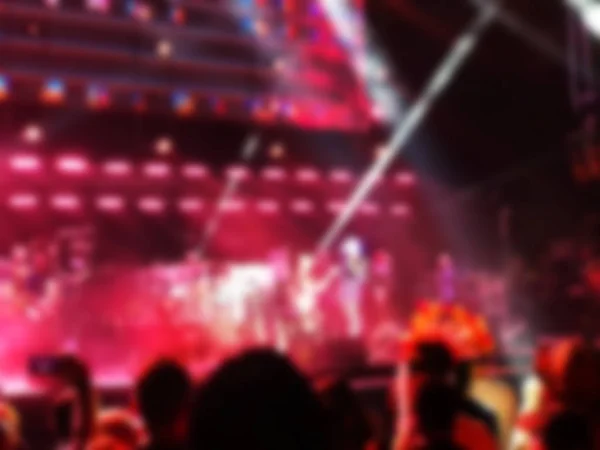 Blurred abstract background. Bokeh lighting in concert with audience. — Stock Photo, Image