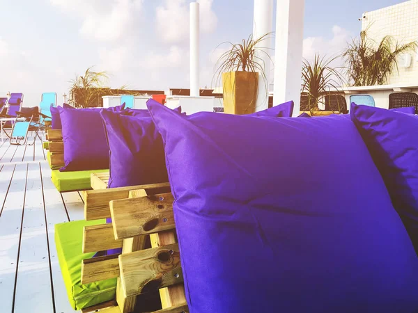 Vacant seats at the open-air bar on the roof