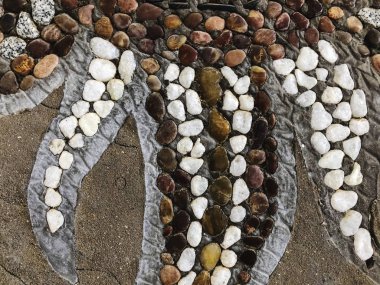 Çizimleri olan güzel bir taş desen. Kapat.