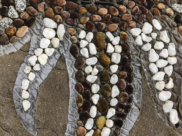 Çizimleri olan güzel bir taş desen. Kapat.