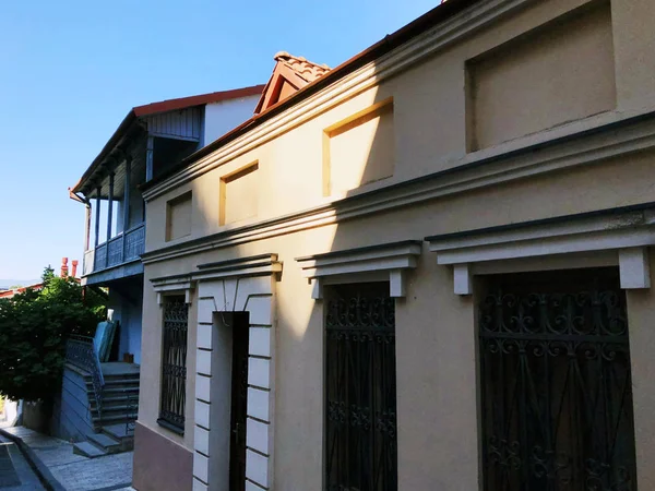 stock image Old Tbilisi architecture, windows and balcony exterior decor in summer day