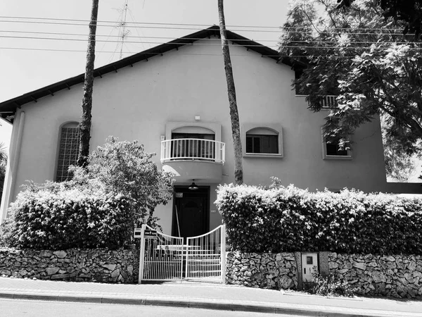 RISHON LE ZION, ISRAEL - June 27, 2018 Private modern house and  trees on the streets in Rishon Le Zion, Israel