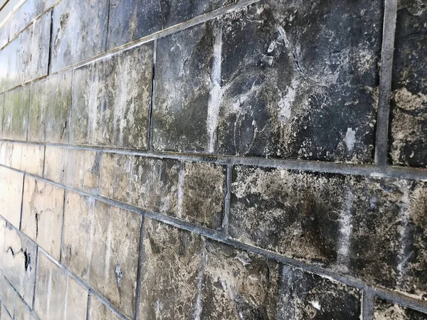 Dinding bata hitam panorama permukaan. Tekstur dinding batu hitam — Stok Foto