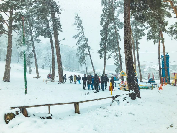 Mountain ski resort Bakuriani, Georgia. The first snow in the city. Children walk in the snow — Stock Photo, Image