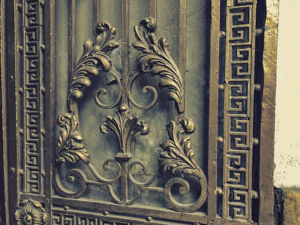 Ornament, detail of an iron gate. Decor and ornament of iron-forged city streets. Old Tbilisi architecture — Stock Photo, Image
