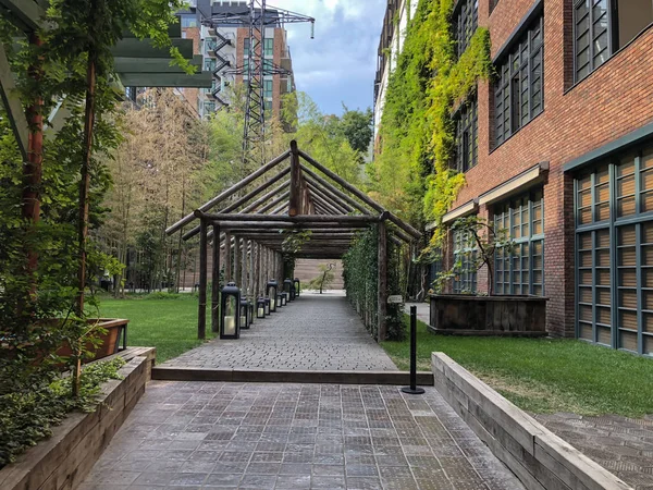 Stamba Hotel: eco-style in the center of Tbilisi. Modern courtyard with beautiful views, alley with a wooden structure.