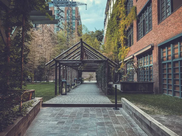 Eco-style in the center of Tbilisi. Modern courtyard in Stamba hotel with beautiful views, alley with a wooden structure.