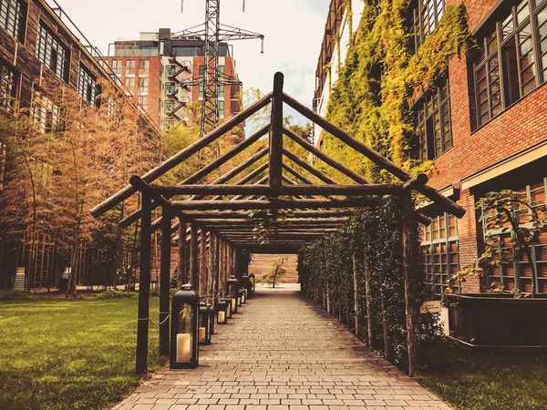 Eco-style in the center of Tbilisi. Modern courtyard in Stamba hotel with beautiful views, alley with a wooden structure.