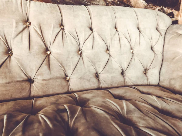 Luxury sofa texture. Light sofa background. Close-up