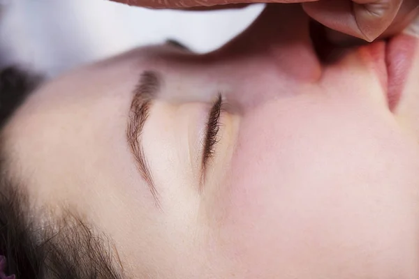 Young woman receiving facial epilation close up. Cosmetologist removes hair on face. Beauty salon, mustache depilation — Stock Photo, Image