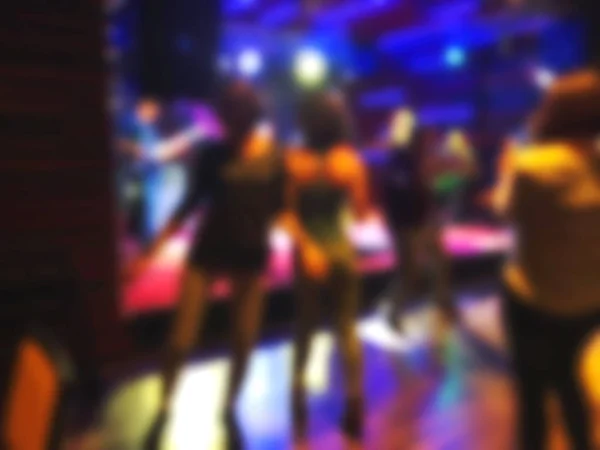 Scene with light, musicians on stage in the rock-cafe. People dancing around the stage. Blur effect — Stock Photo, Image