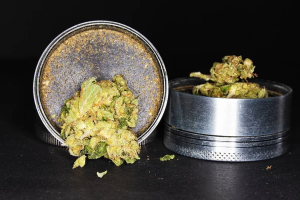 Metal grinder with marijuana, isolated on a black — Stock Photo, Image