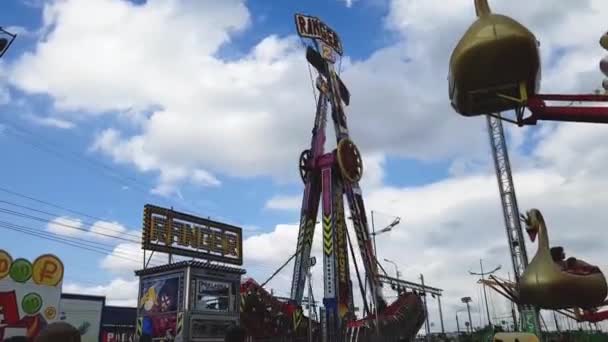 Amusement park, lots of people have a fun, ride roundabouts — Stock Video