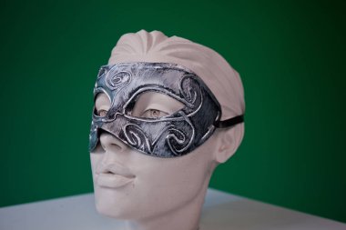 female mannequin in mask