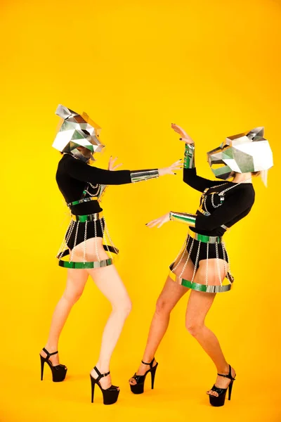 Amazing GoGo girls with metal panther heads posing in studio