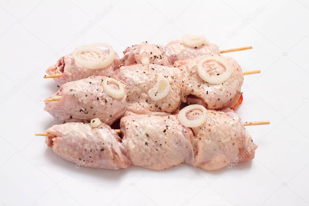 Grilled chicken on a Board, on a white background with vegetables.