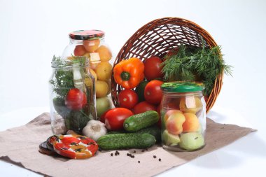 Vegetables for preservation glass jars. clipart