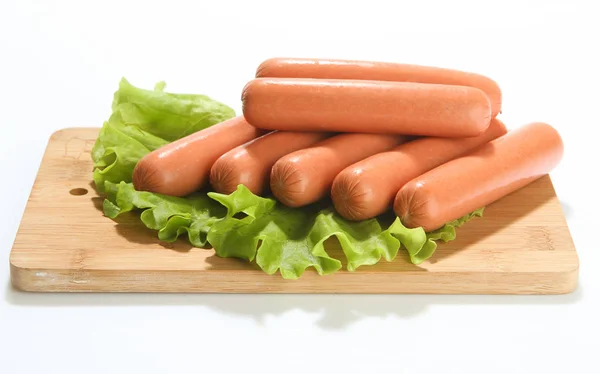 Raw sausage sausages with vegetables.