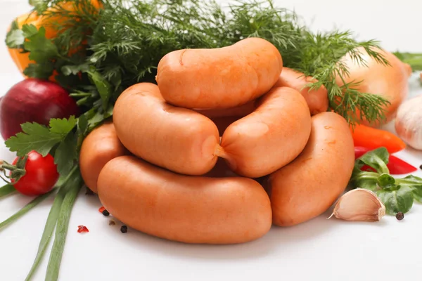 Raw sausage sausages with vegetables.