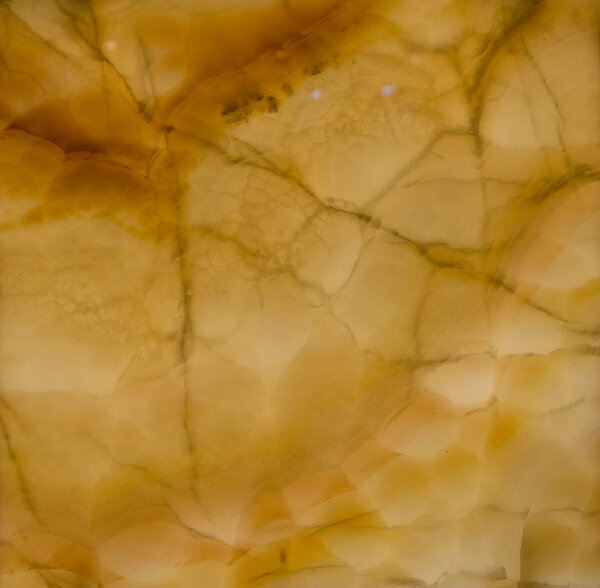 Onyx stone polished yellow. For texture.