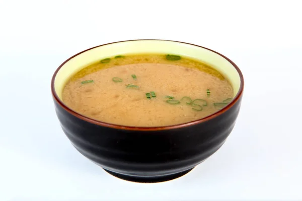 Chinese soup in a Cup on a light background.