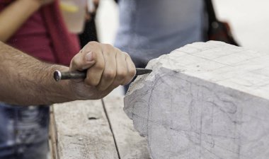 Carving stone, craftsman shaping stone, art and crafts clipart