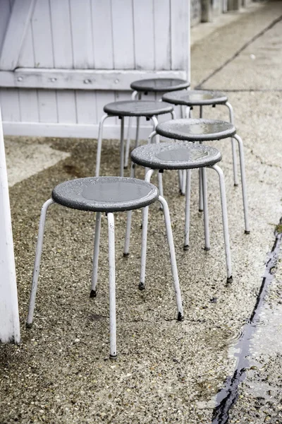 Wet benches in the street — Stock Photo, Image