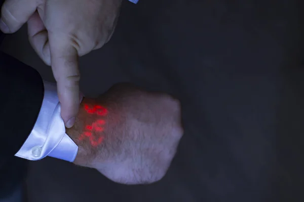 glowing watch on a hand