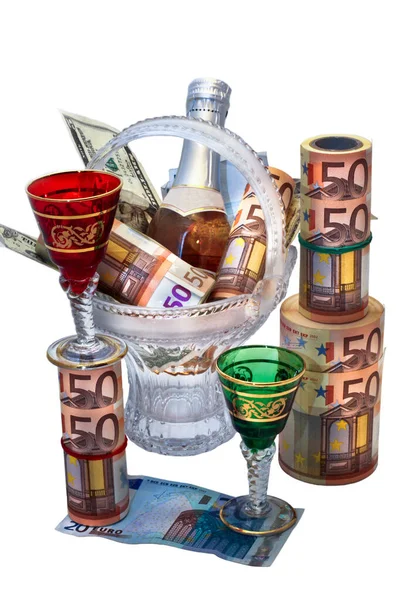 Money of different denominations, a bottle of wine and two glasses on the white background — Stock Photo, Image