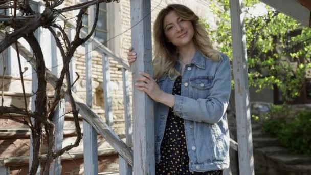 Portrait young attractive woman look at camera at old Georgian city feel happy — Stock Video