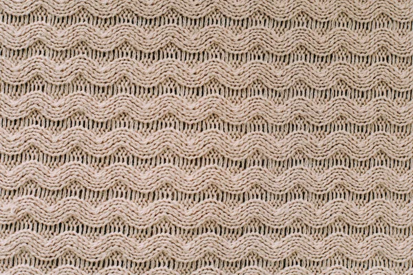 Knitted background. Knitting pattern of wool. Knitting. Texture of knitted woolen  fabric for wallpaper and an abstract background — Stock Photo, Image