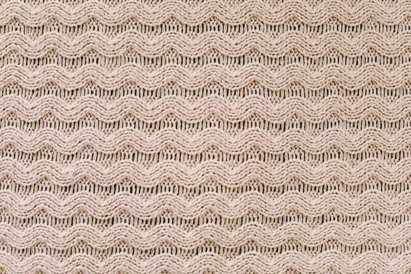 Knitted background. Knitting pattern of wool. Knitting. Texture of knitted woolen  fabric for wallpaper and an abstract background — Stock Photo, Image