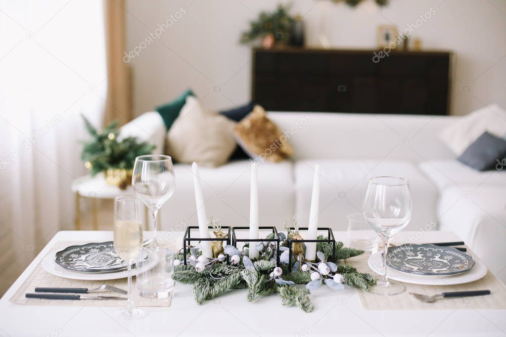 Serving a festive table. New year decorations. Christmas and  New Year concept